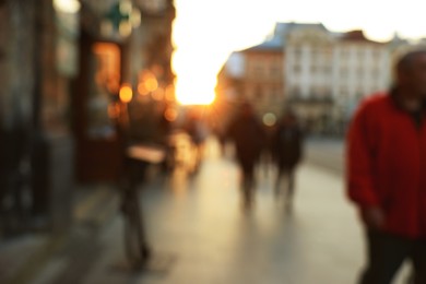 Blurred view of people walking on city street