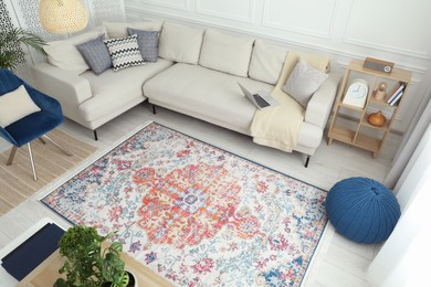 Photo of Stylish living room with beautiful carpet and furniture, above view. Interior design