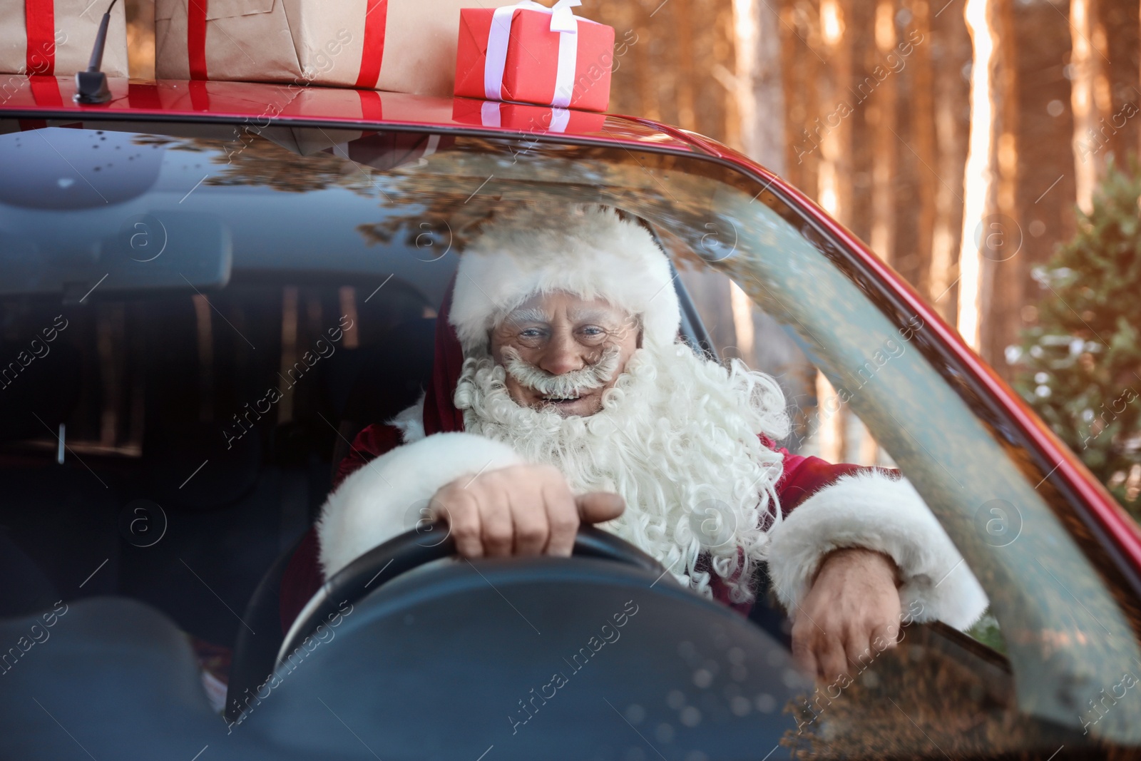 Photo of Authentic Santa Claus in car, view through windshield