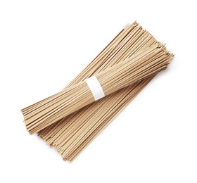 Uncooked buckwheat noodles (soba) isolated on white, top view
