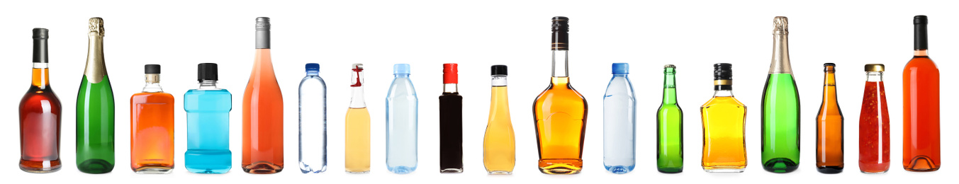 Image of Set of bottles with different liquids on white background. Banner design