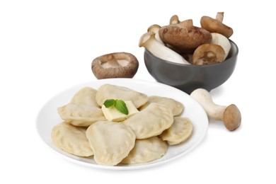 Photo of Delicious dumplings (varenyky) with mushrooms and butter isolated on white