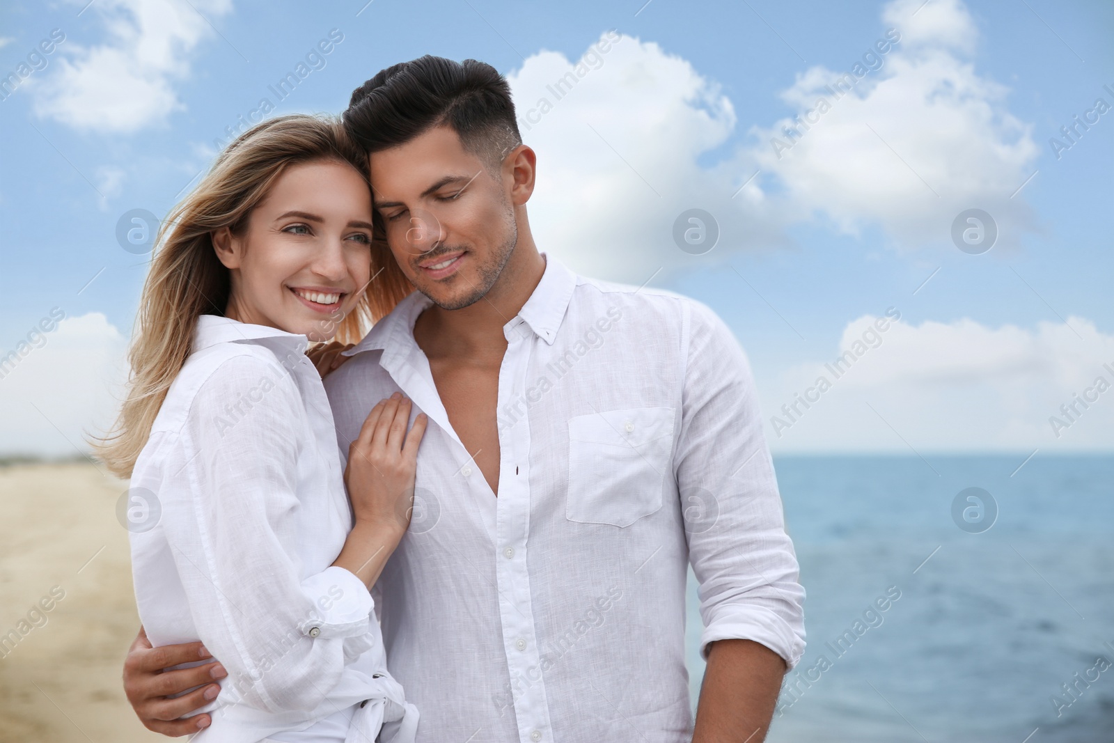 Photo of Happy couple on sea beach. Romantic walk