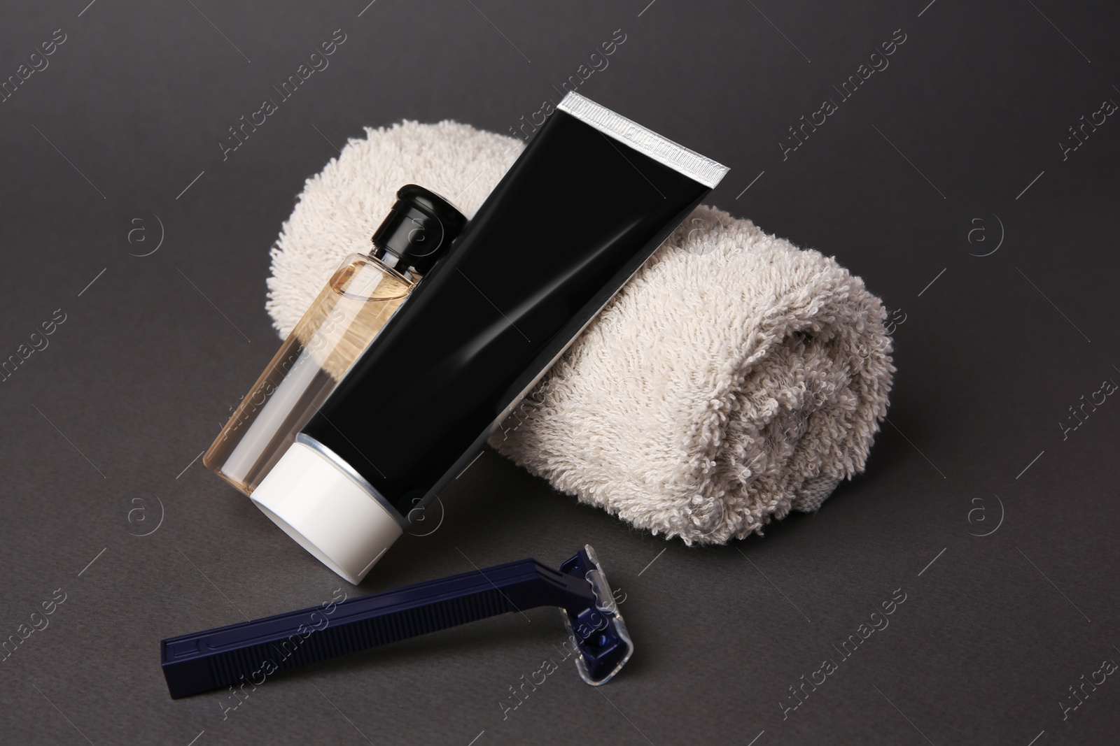 Photo of Different men's shaving accessories on grey background, closeup