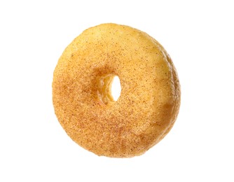 Sweet tasty glazed donut with cinnamon powder isolated on white