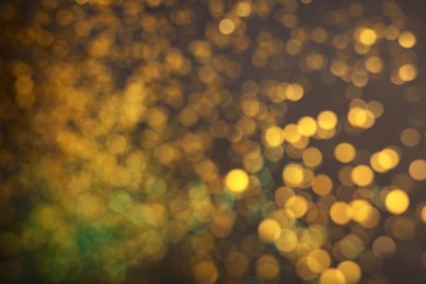 Photo of Blurred view of shiny glitter as background. Bokeh effect