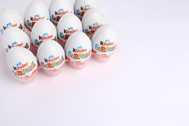 Sveti Vlas, Bulgaria - June 26, 2023: Kinder Surprise Eggs in plastic tray on white background. Space for text