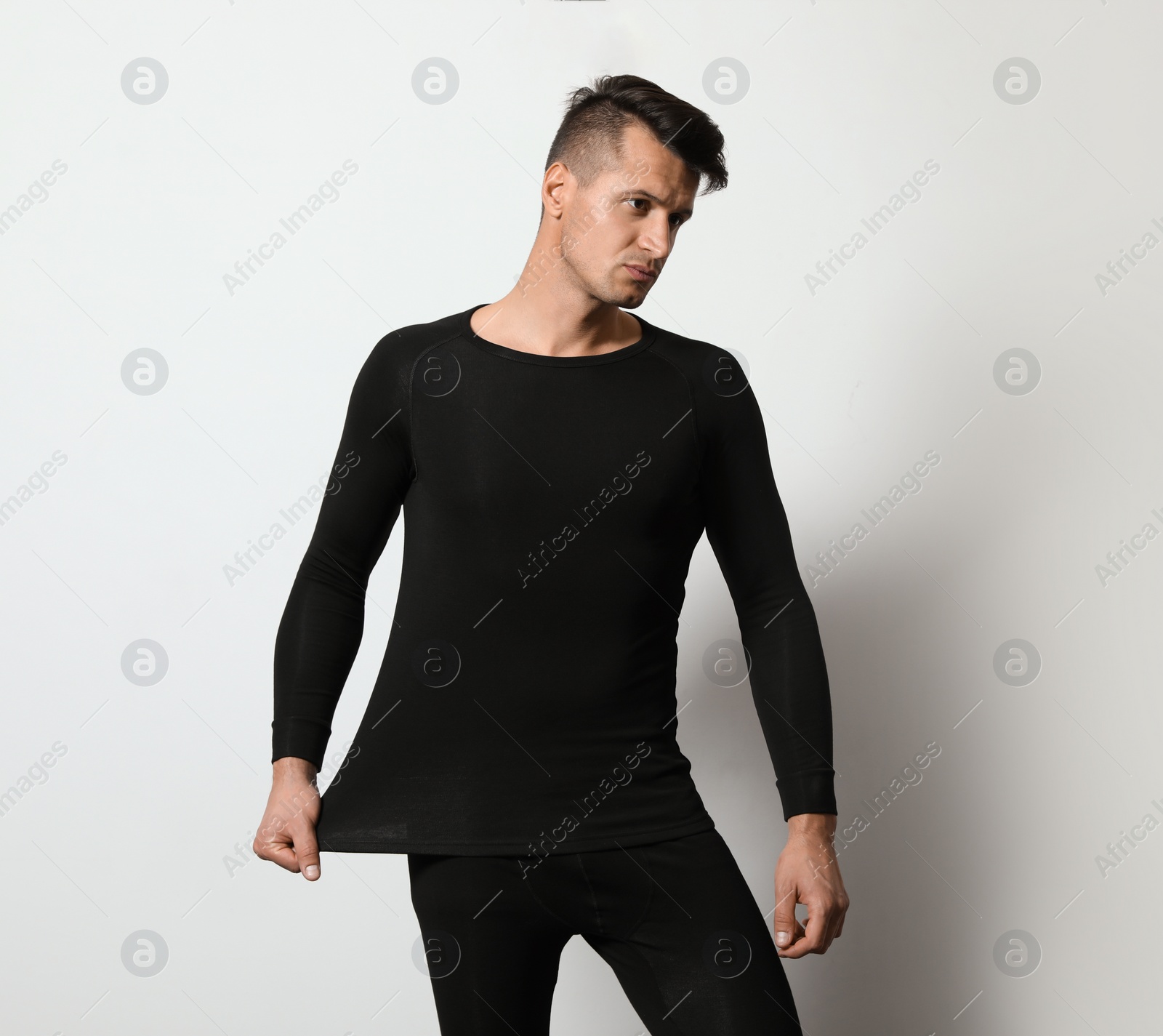 Photo of Man wearing thermal underwear on light grey background