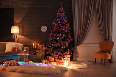 Photo of Stylish room interior with decorated Christmas tree