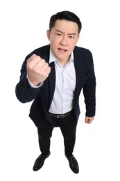 Angry businessman in suit posing on white background, above view