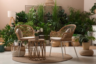 Photo of Room interior with stylish furniture and different houseplants