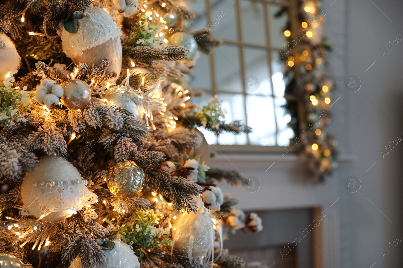 Photo of Closeup view of beautiful decorated Christmas tree indoors