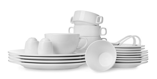 Photo of Set of clean dishware isolated on white