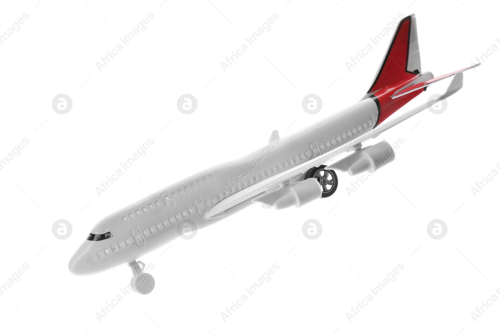 Photo of Toy airplane isolated on white. Travel concept