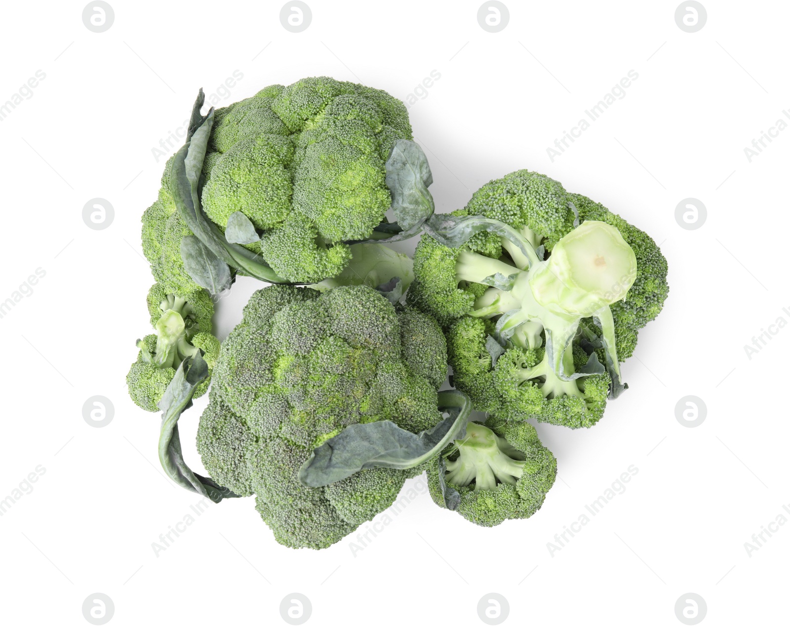 Photo of Pile of fresh raw green broccoli isolated on white, top view