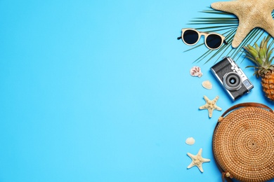 Photo of Flat lay composition with beach accessories on color background, space for text