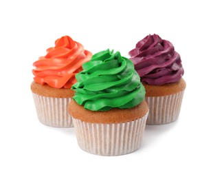 Different delicious colorful cupcakes on white background