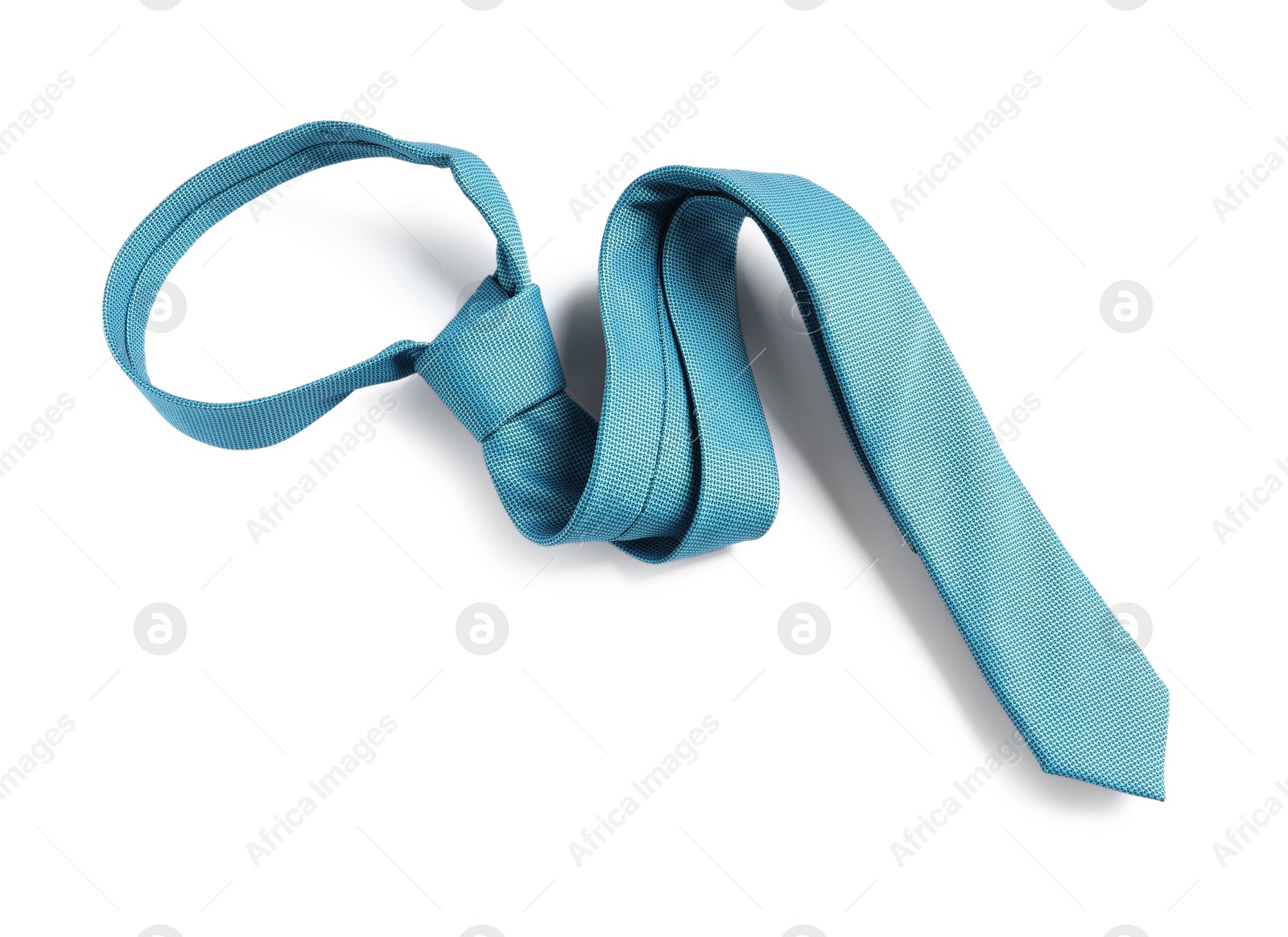Photo of One light blue necktie isolated on white, top view
