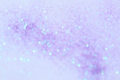 Shiny lilac background with magical bokeh effect