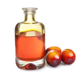 Image of Palm oil in glass bottle and fruits on white background