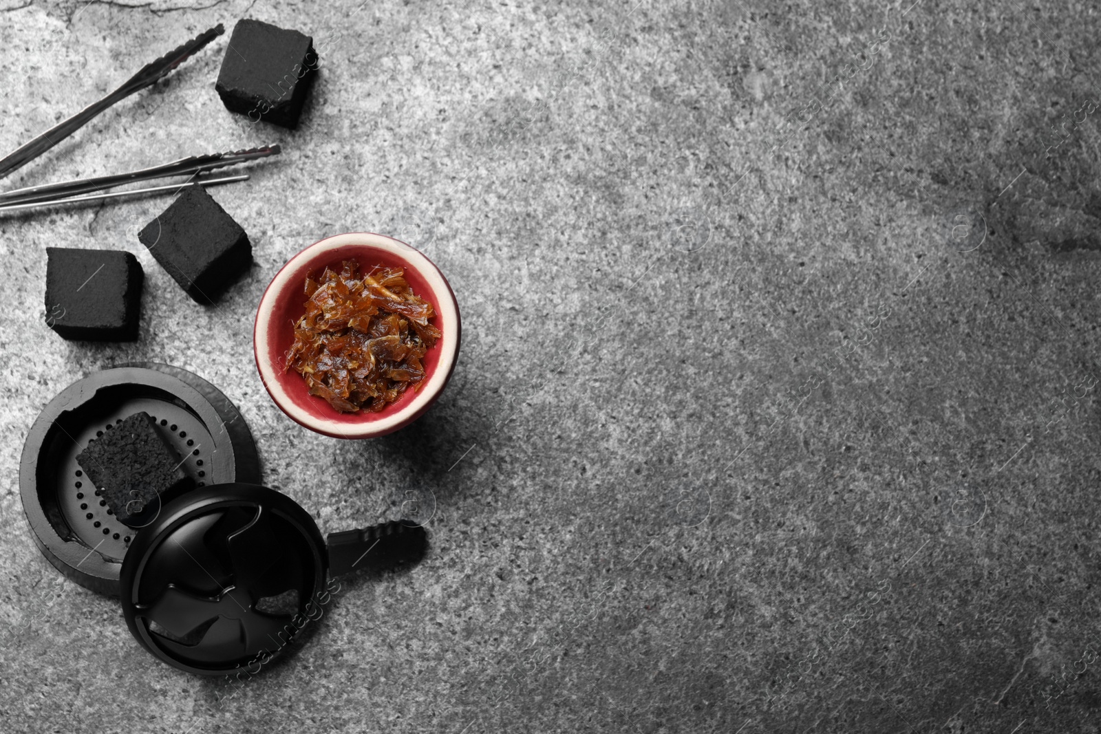 Photo of Flat lay composition with parts of hookah on grey table, space for text