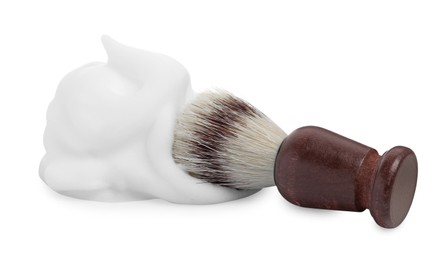 Shaving foam and brush on white background