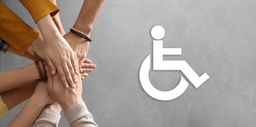 Image of Inclusive workplace culture, banner design. International symbol of access. People holding hands together, top view