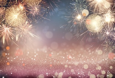 Image of Abstract festive background with fireworks, bokeh effect. New Year celebration