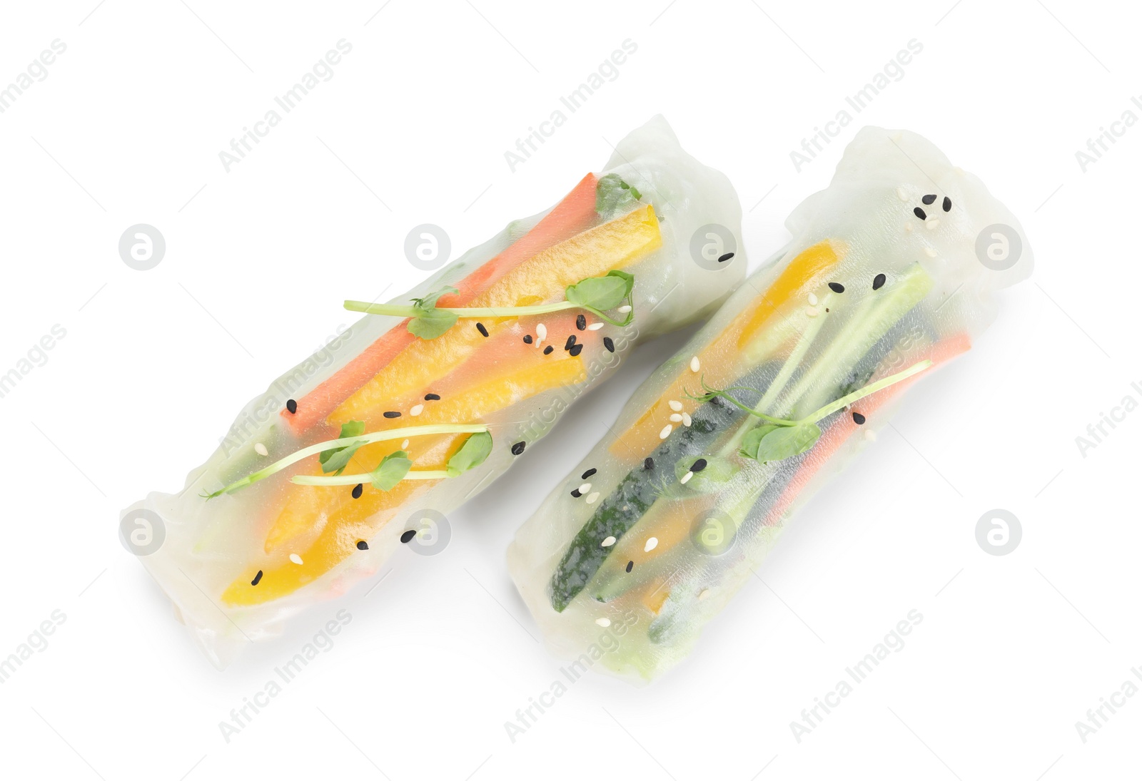 Photo of Tasty spring rolls with sesame seeds and microgreens isolated on white, top view