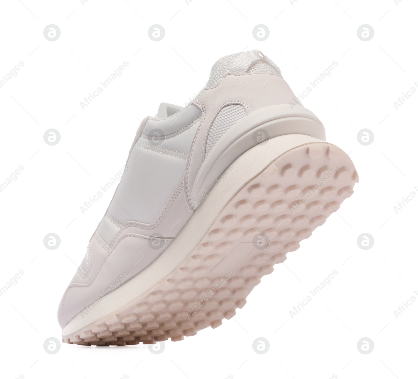 Photo of One stylish new sneaker isolated on white