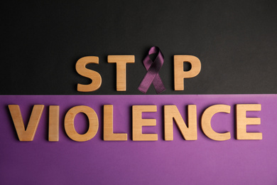 Photo of Purple ribbon and phrase STOP VIOLENCE on color background, flat lay