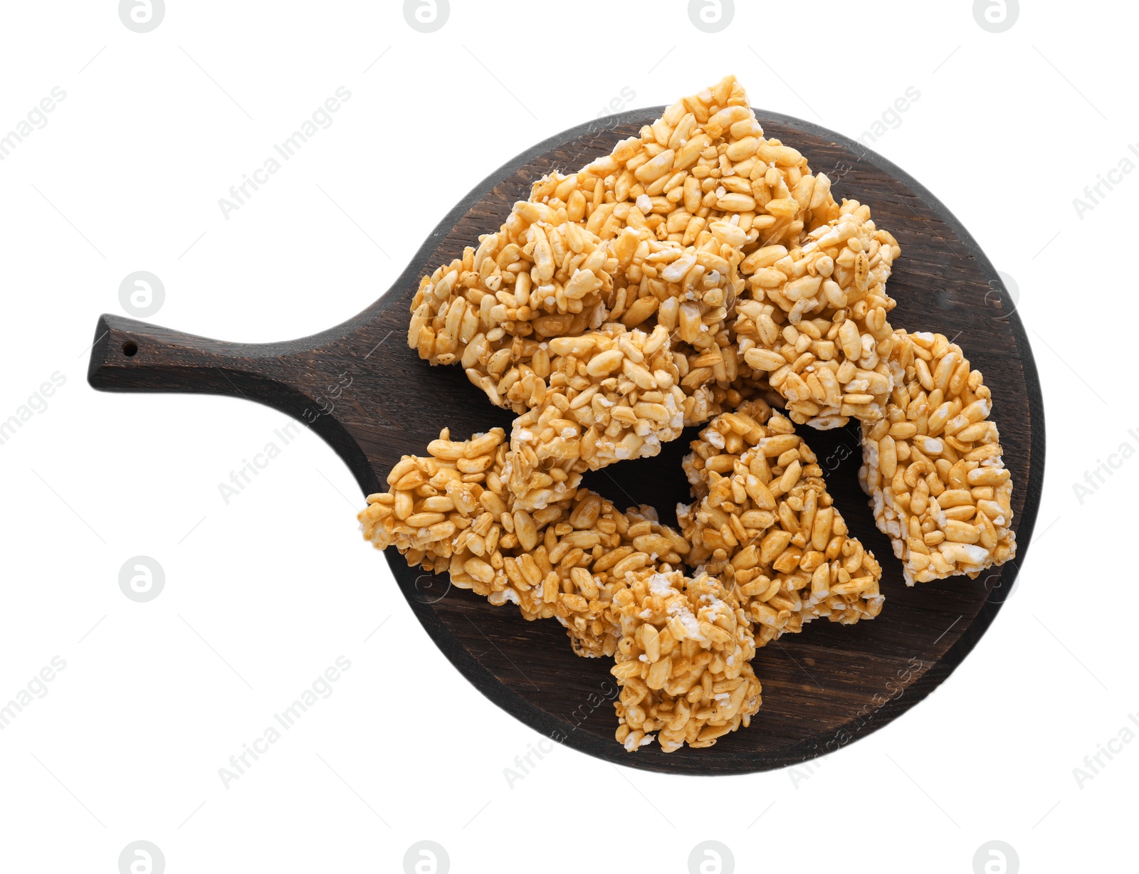 Photo of Wooden board with puffed rice bars (kozinaki) on white background, top view