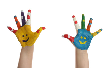 Kid with smiling faces drawn on palms against white background, closeup