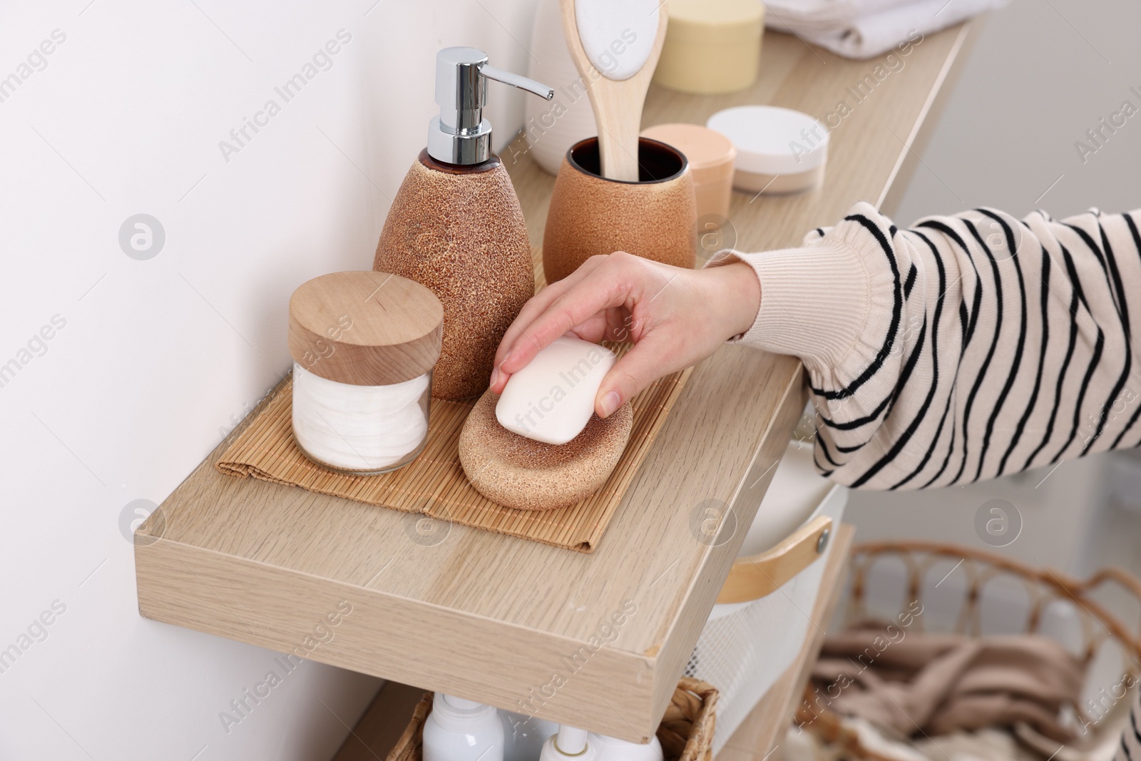 Photo of Bath accessories. Woman with soap indoors, closeup