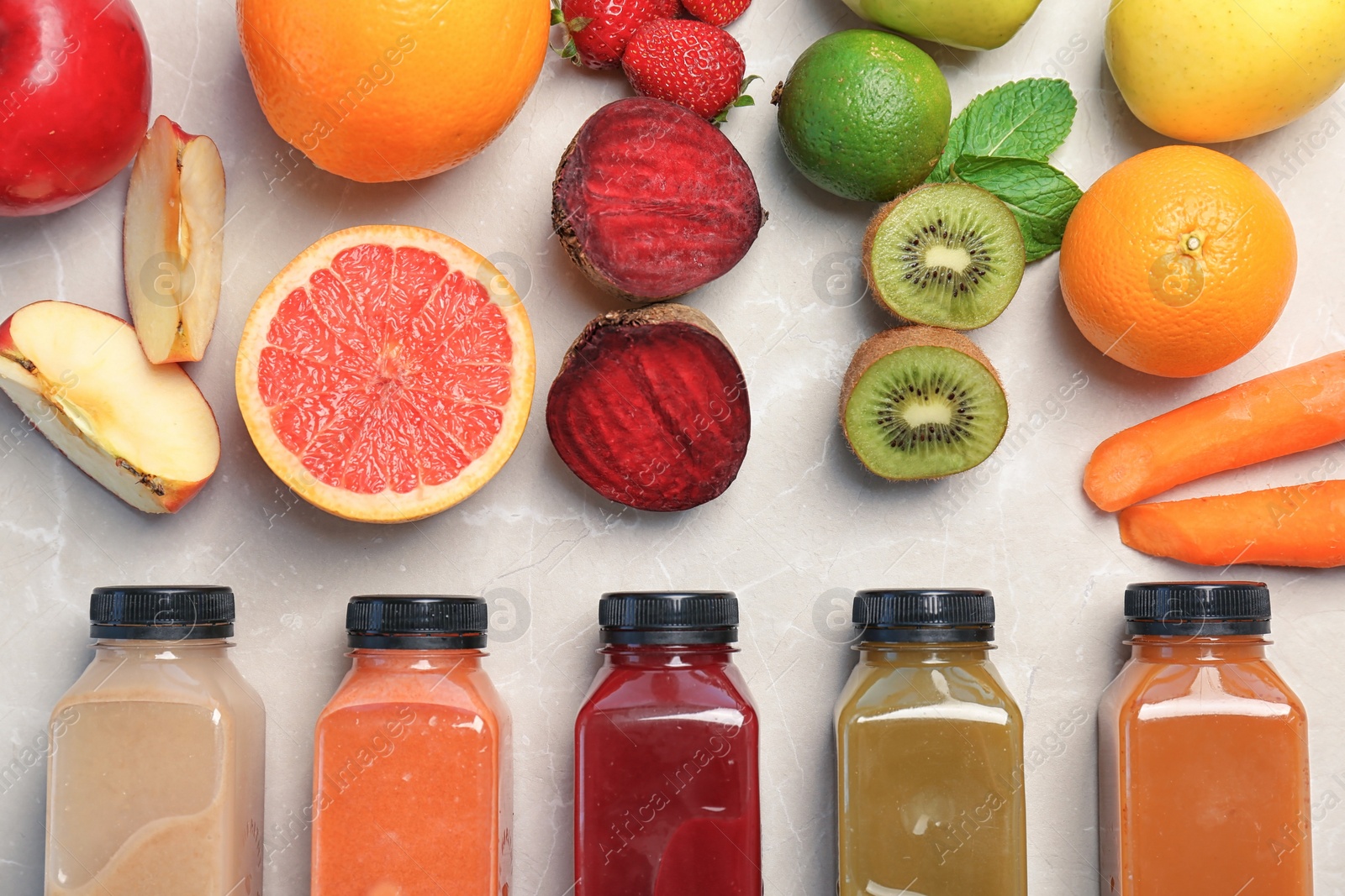 Photo of Flat lay composition with healthy detox smoothies and ingredients on light background