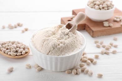 Kidney bean flour and seeds on white wooden table