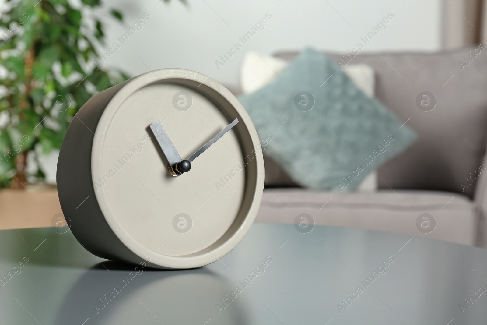 Photo of Analog clock on table indoors, space for text. Time management