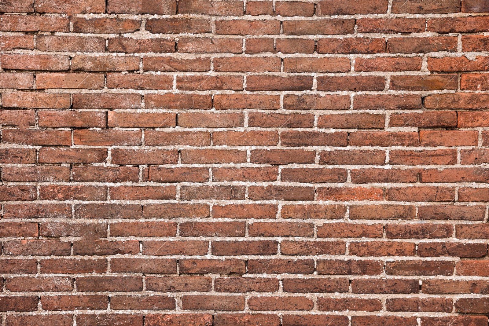 Photo of Texture of old red brick wall as background