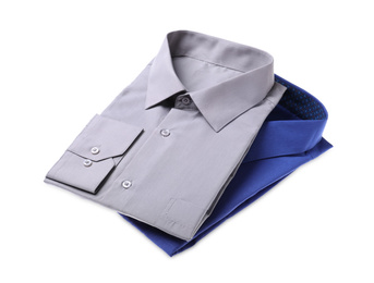 Photo of Stylish shirts isolated on white. Dry-cleaning service