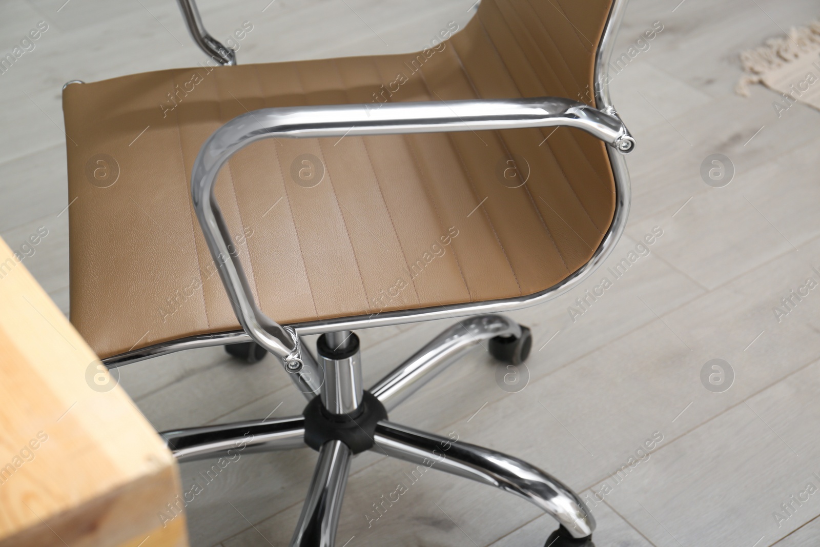 Photo of Modern comfortable office chair in room, closeup