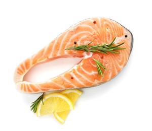 Photo of Fresh salmon steak with rosemary and lemon on white background, top view