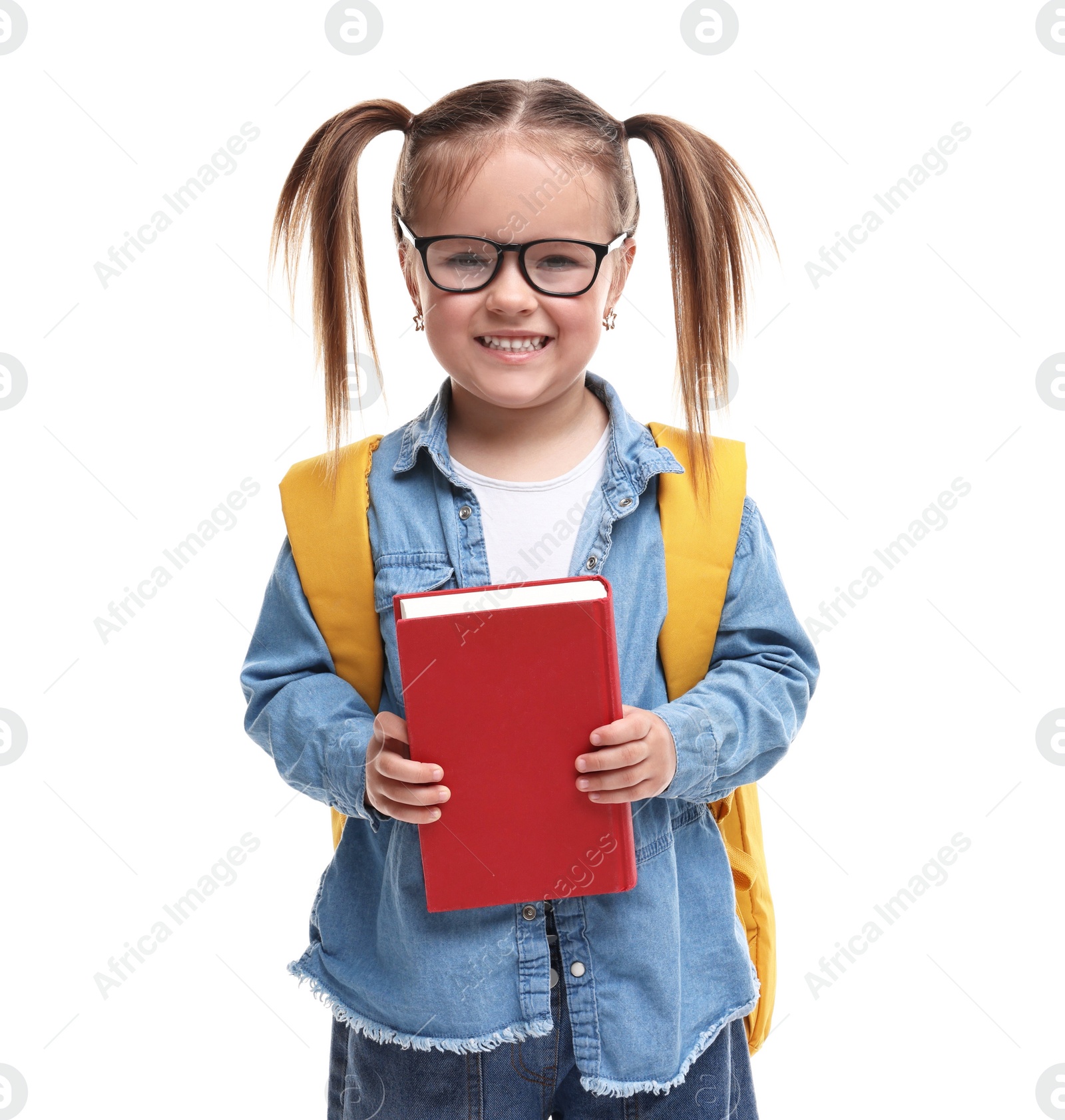 Photo of Cute little girl in glasses with book and backpack on white background