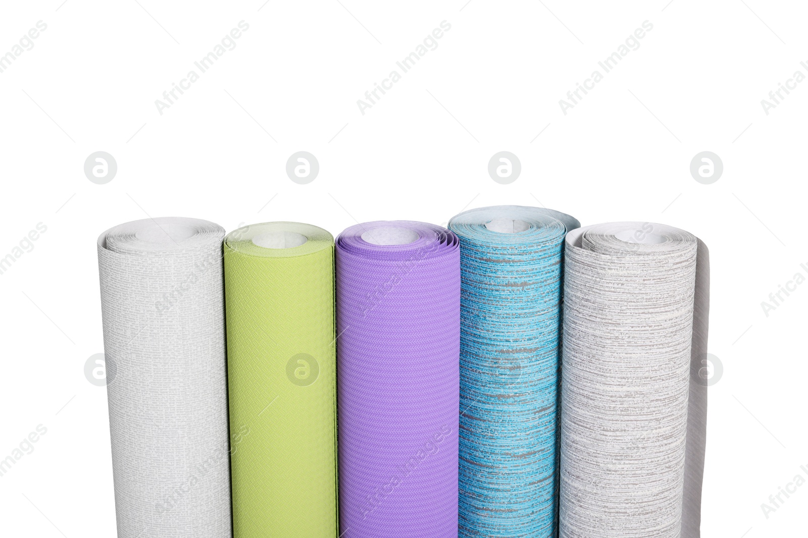 Photo of Many different wallpaper rolls isolated on white