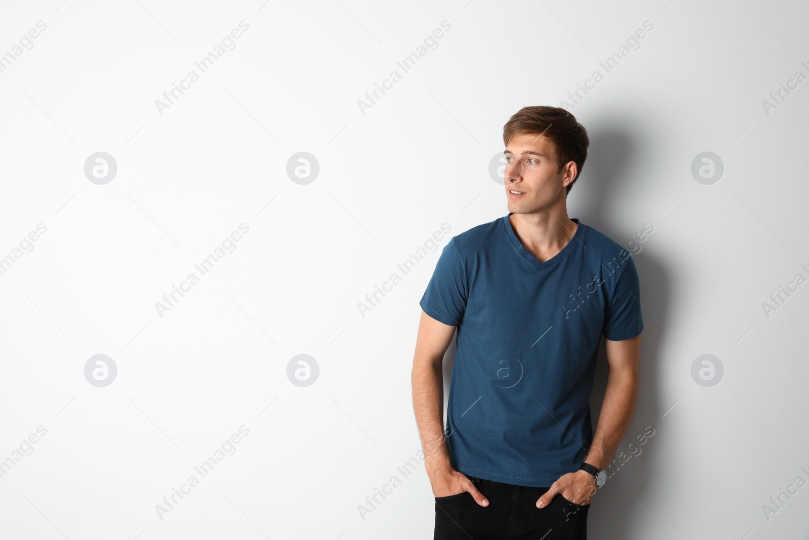 Photo of Portrait of handsome man on light background. Space for text