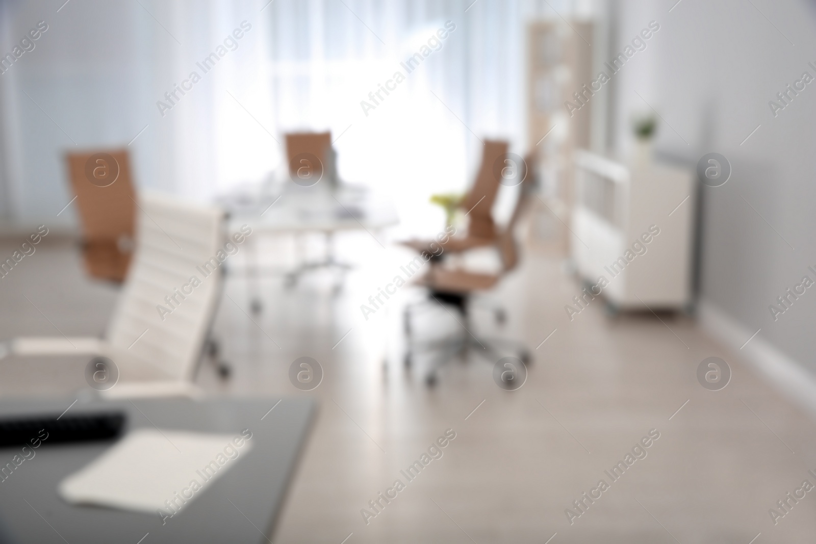 Photo of Modern brightly lit office with bokeh effect