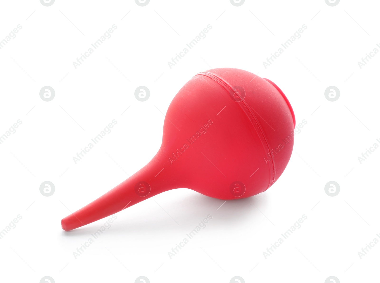 Photo of Red enema on white background. Medical treatment