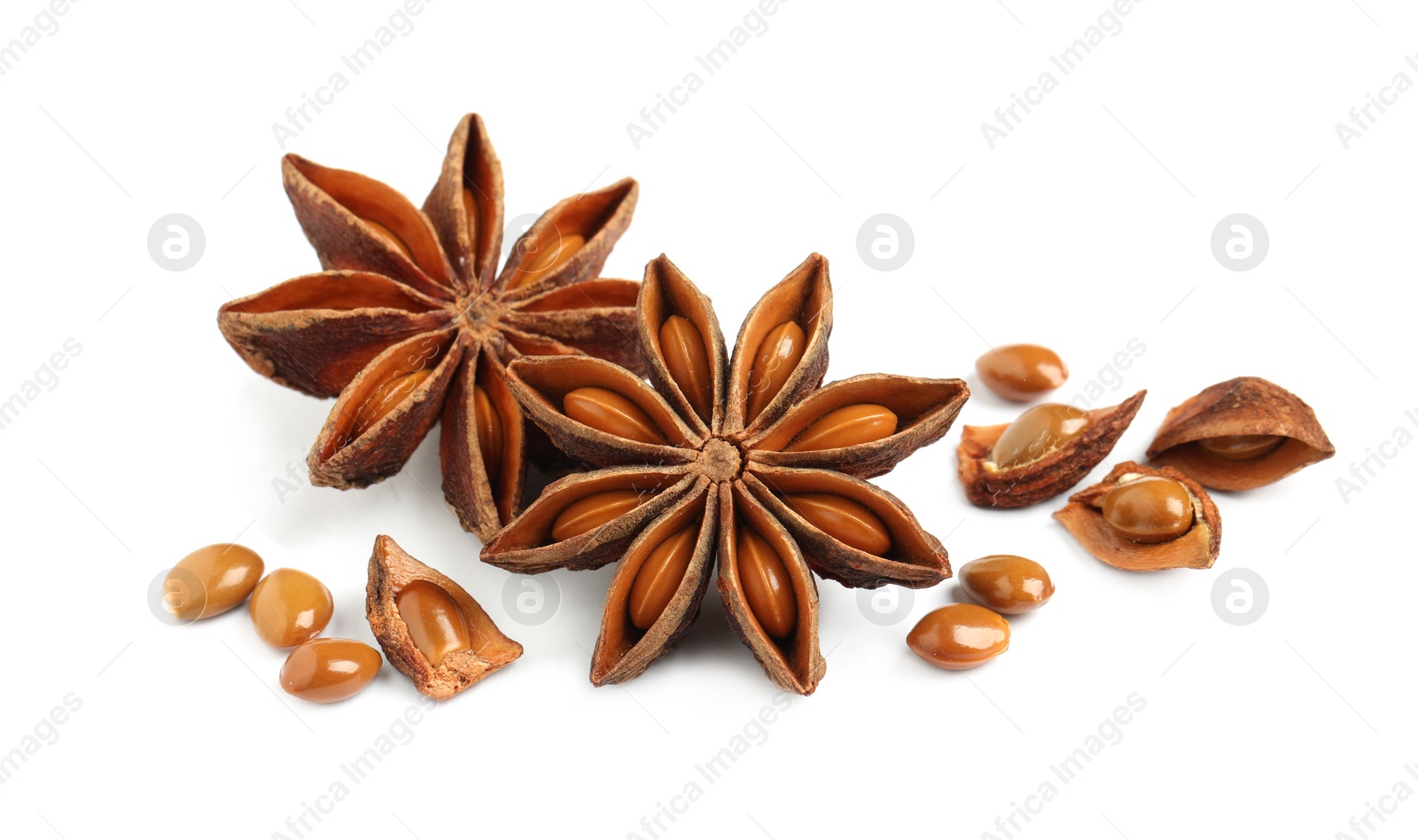 Photo of Dry anise stars with seeds on white background