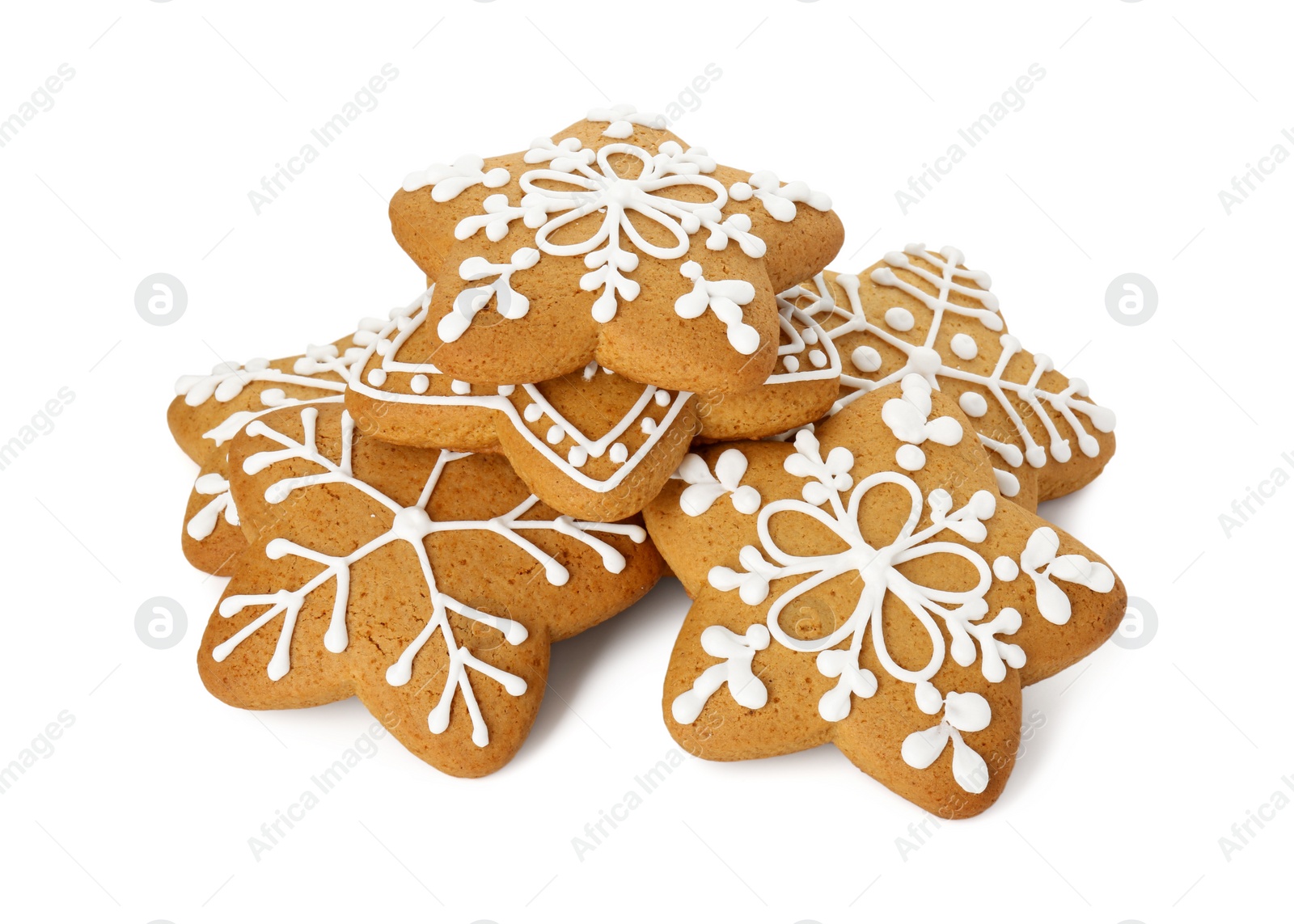 Photo of Tasty star shaped Christmas cookies with icing isolated on white