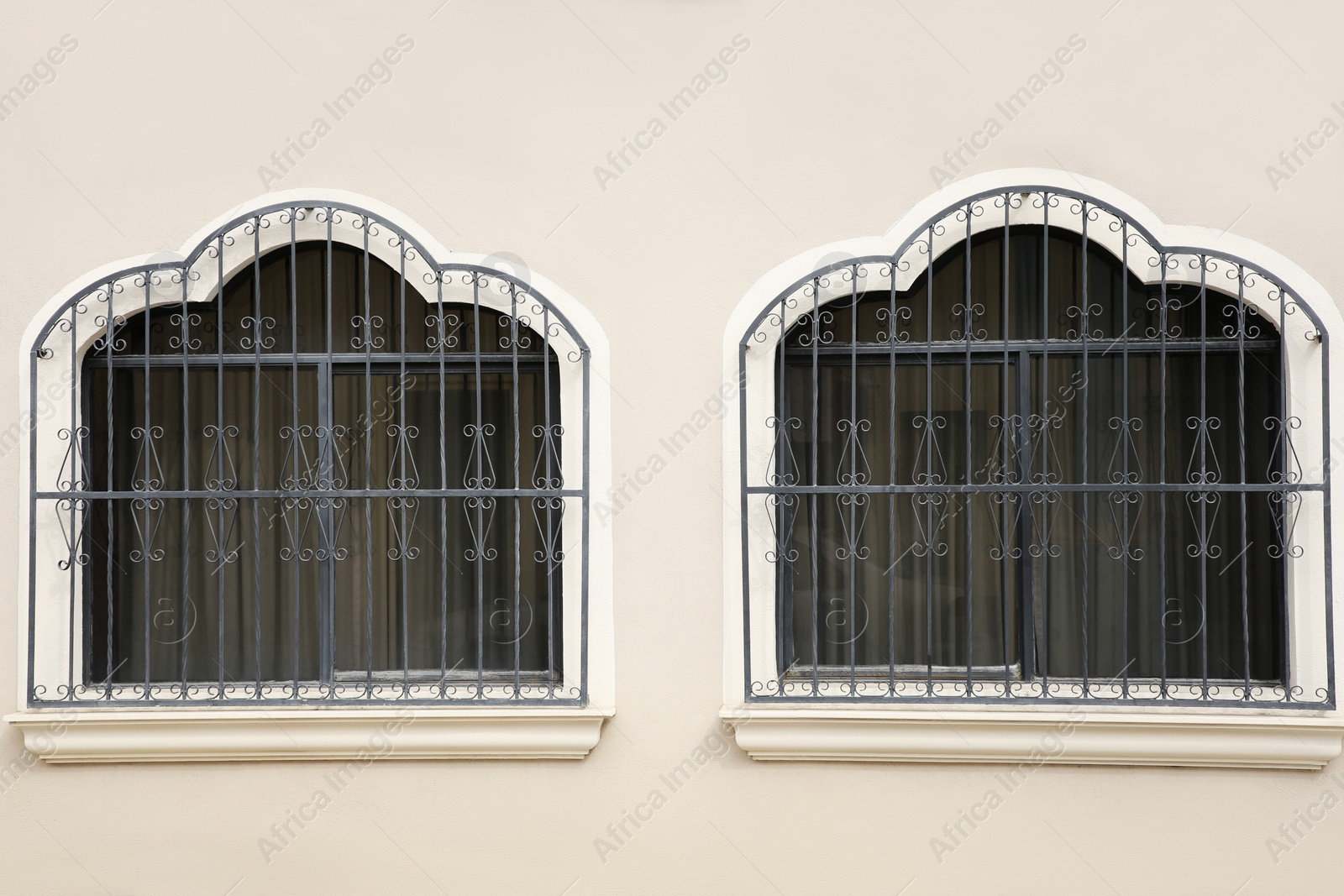 Photo of Building with beautiful windows and steel grilles