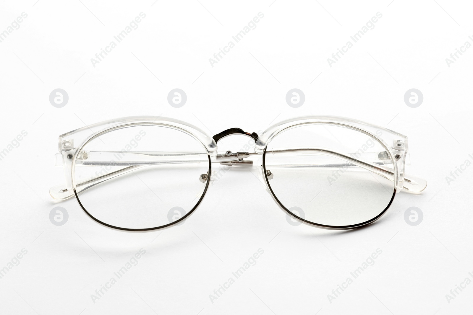 Glasses with corrective lenses on white background. Vision problem Photo of Glasses with corrective lenses on white background. Vision problem